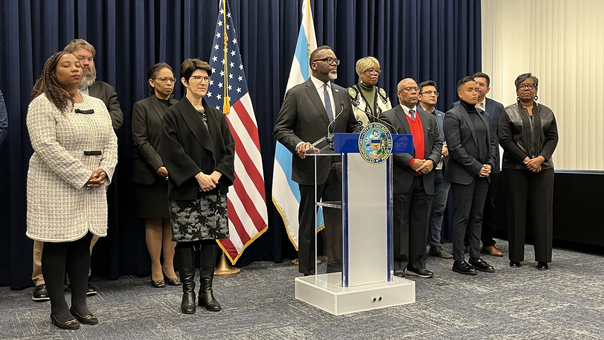 Mayor Brandon Johnson with alders and members of his staff, including budget director Annette Guzman, who is referenced in the letter from the DOJ. Photo: Monica Eng/Axios